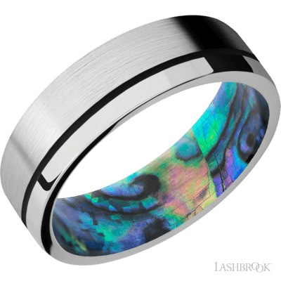 7 mm wide/Flat/14K White Gold band with one 0.5 mm Off Center inlay of Black also featuring a Abalone sleeve.