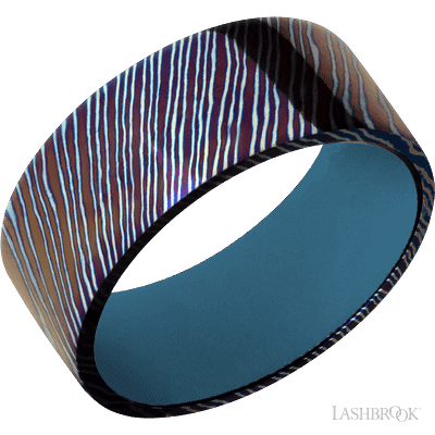 9 mm wide Flat Titanium Damascus band featuring a Royal Blue sleeve.